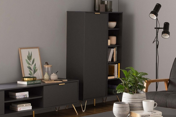 Black cabinet crafted from laminated board, with 1 door and shelves. 