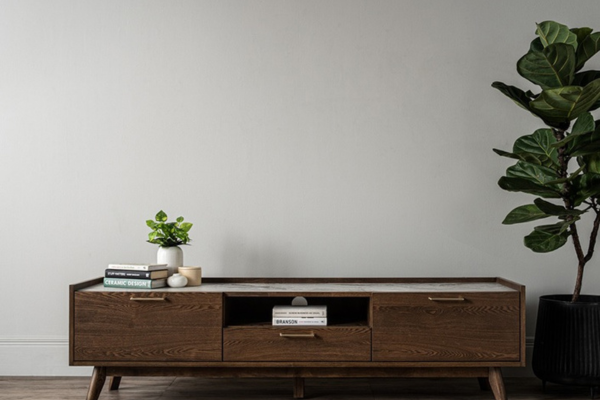 Brown TV cabinet crafted from melamine, with 3 drawers and sturdy wooden legs. 